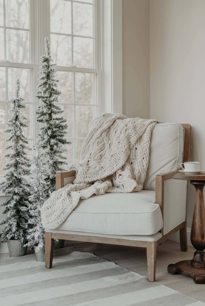 chair with soft blanket cup coffee small table white room min 1 chair with soft blanket cup coffee small table white room min 1