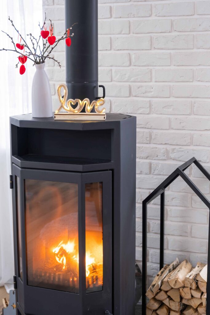 valentine decor near fireplace stove with fire firewood cozy home hearth interior with potted plans valentines day family love nest min 1 valentine decor near fireplace stove with fire firewood cozy home hearth interior with potted plans valentines day family love nest min 1