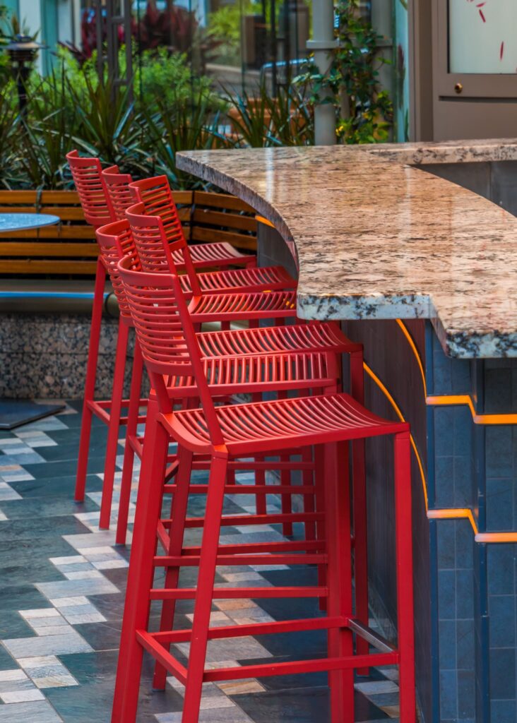 empty chairs tables sidewalk cafe min