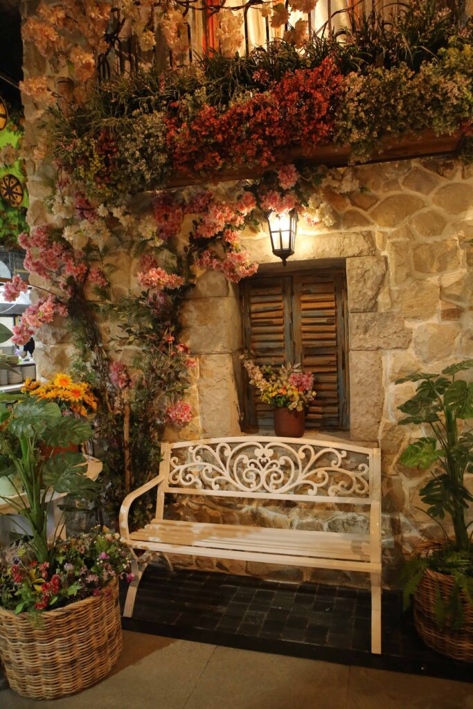 stone wall with window that says flowers it 1 stone wall with window that says flowers it 1